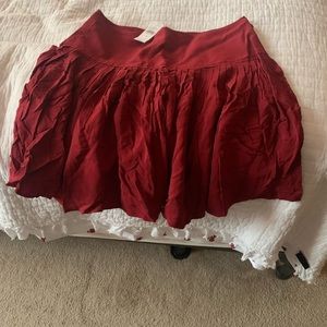 Cute short pleated rust color above the knee skirt